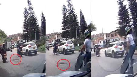 hueco en Medellín-mujer-moto